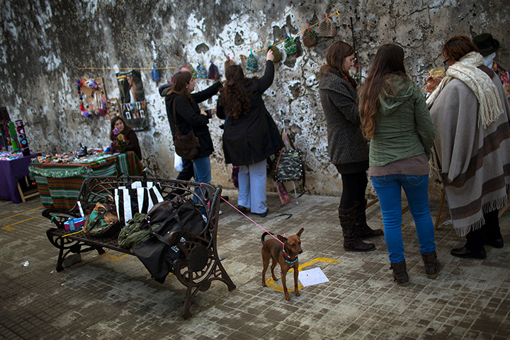 24 hours: Zahara de los Atunes, Spain: Women buy clothes at street stalls
