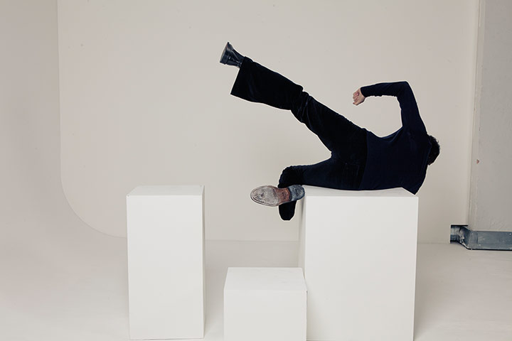 Noel Fielding - Glam: Noel Fielding falling off white blocks