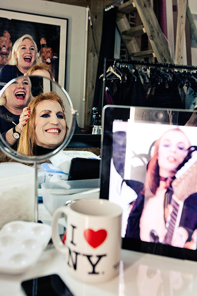 Noel Fielding - Glam: Noel Fielding laughing in mirror wearing wig