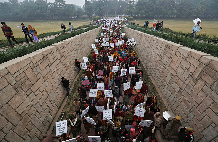 20 Photos: Women enter Raj Ghat for a prayer ceremony for a rape victim in New Delhi