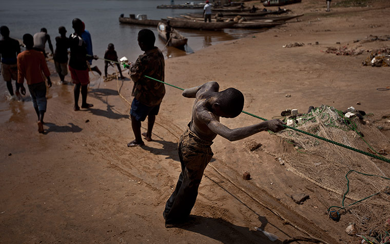 20 Photos: A boy fisherman at the river Ubangi in the Central African Republic