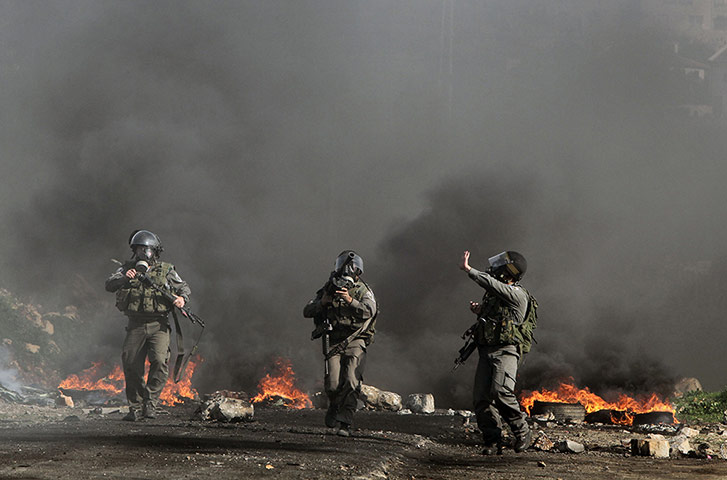 20 Photos: Israeli soldiers wearing gas masks near Nablus