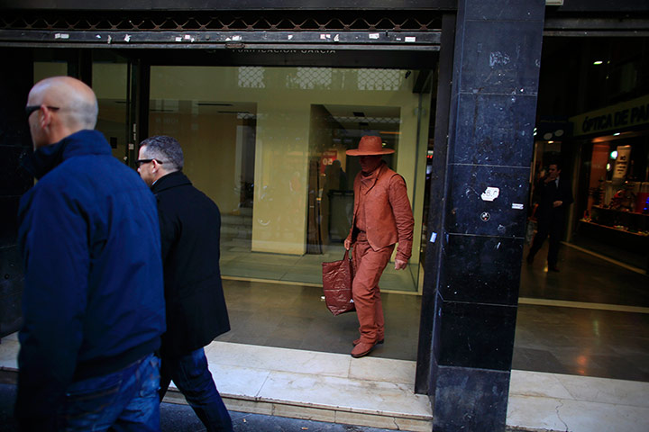 24 Hours: A mime artist dressed up as a cowboy walks in Seville