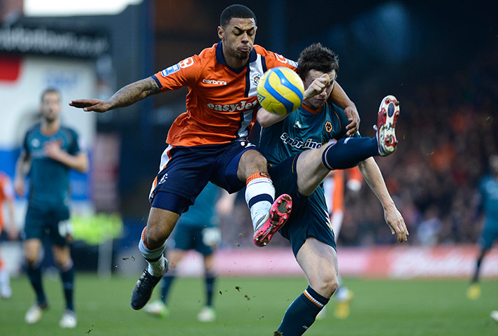 luton v wolves: Andre Grey of Luton and Kevin Foley of Wolves
