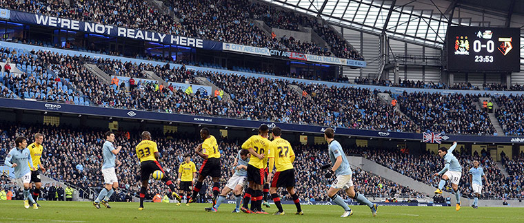 Manchester City's Carlos Tevez scores