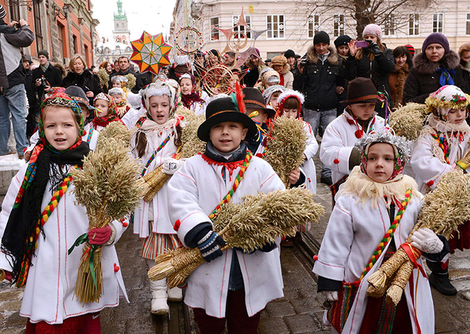 Epiphany Day: Children wear traditional dresses as they parade