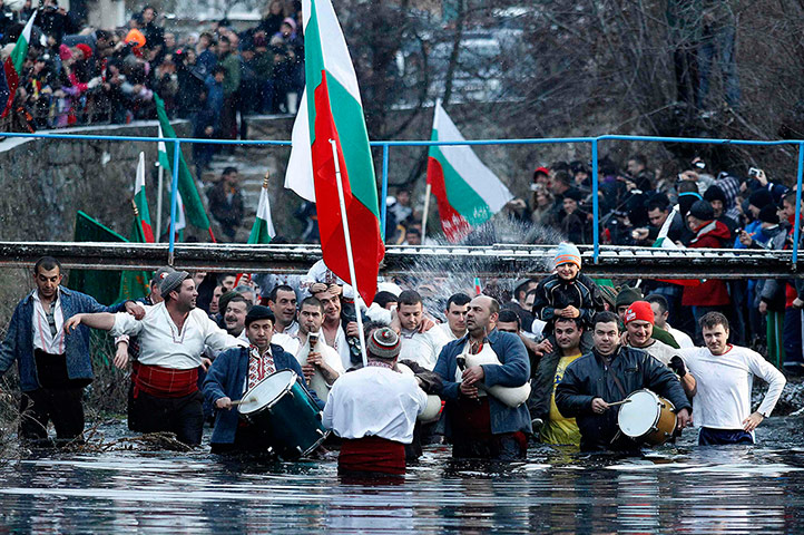 Epiphany Day: Bulgarian men dance in the icy waters of the Tundzha river 
