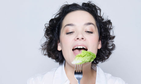 Eating a salad leaf with a fork