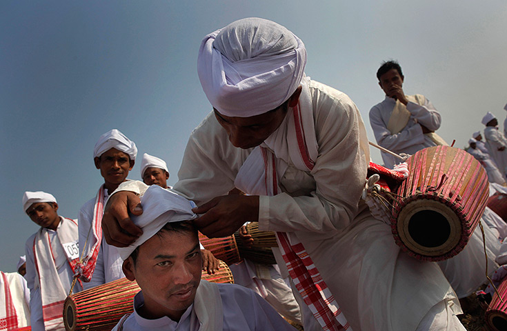 24 hours: Titabar, India: Men prepare to play the khol