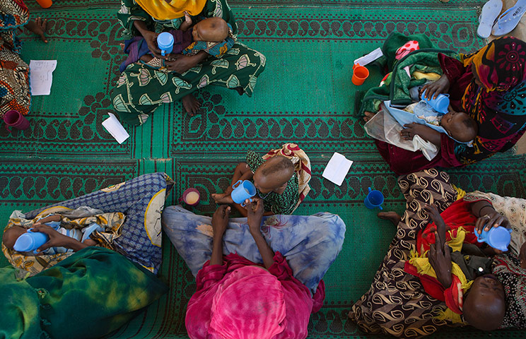 Chad Stunted Nation:  mothers feed their malnourished children at a nutritional health clinic