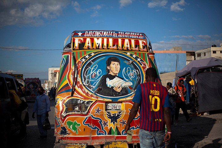 24 hours: Port-au-Prince, Haiti: A man wearing a Barcelona FC Lionel Messi top