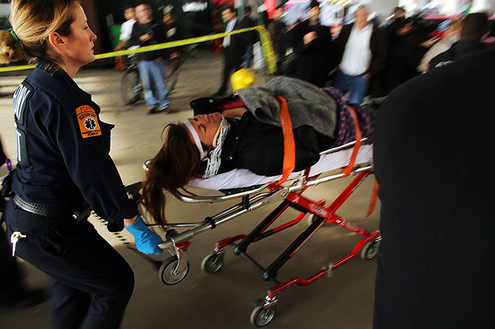 Seastreak ferry: An injured person is carried to a waiting ambulance