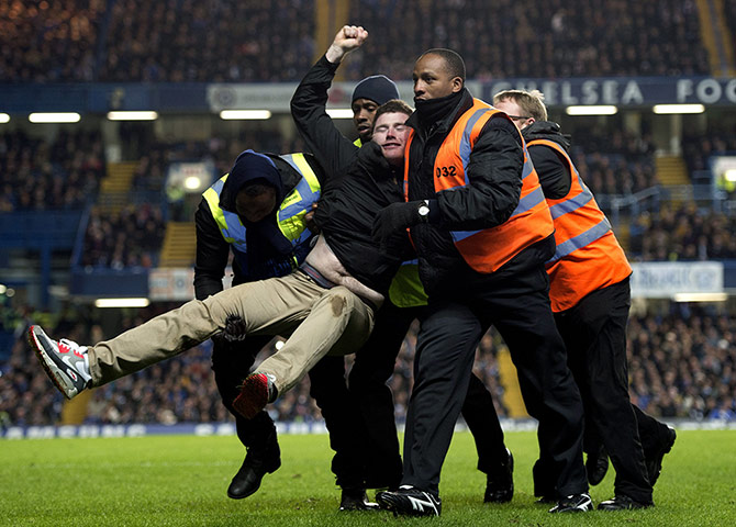 sport4: A supporter is removed from the pitch
