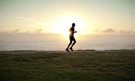 A silhouette of a jogger 