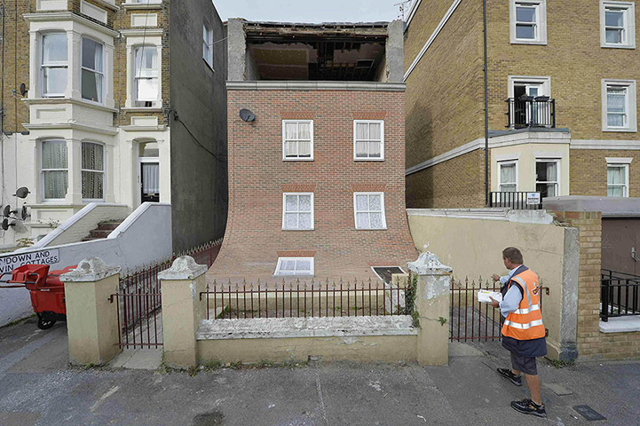 20 Photos: Postal worker Glenn Gray looks at a piece of public art in Margate