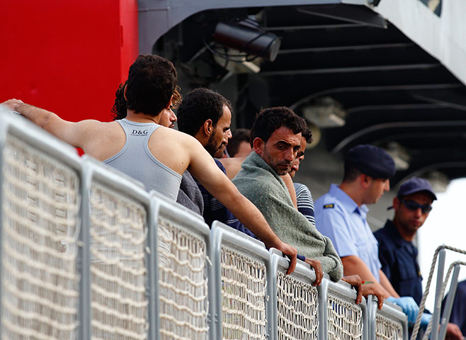 Malta: Rescued migrants wait to disembark from a Maltese ship 