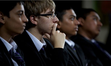 Audience of schoolchildren watch a play