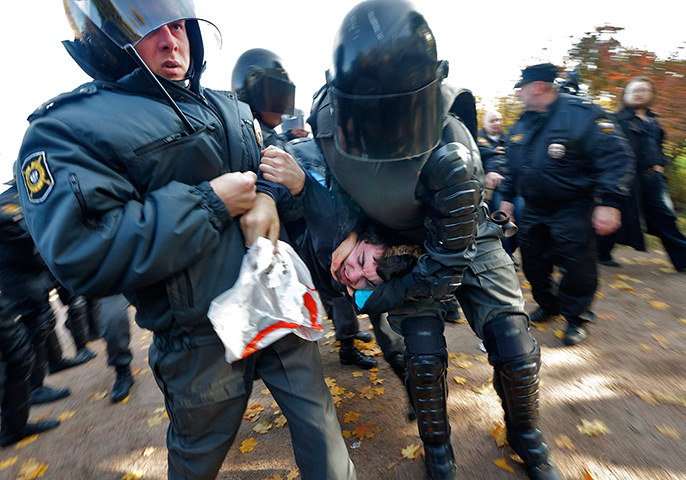 Weekend in pictures: St Petersburg, Russia: Riot police detain an anti-gay protester during an a