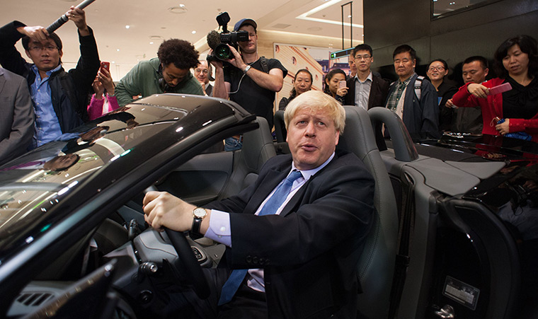 Boris in China: Mayor of London Boris Johnson sits in a Jaguar sports car as he tours the s