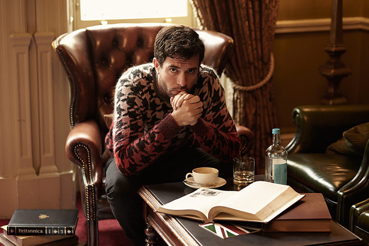 Downton Abbey - Weekend: Tom Cullen from Downton Abbey sits in chair wearing jumper