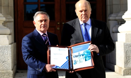 Minister for Public Expenditure and Reform Brendan Howlin (left) and Minister for Finance Michael Noonan deliver the 2014 Budget at Government Buildings, Dublin.