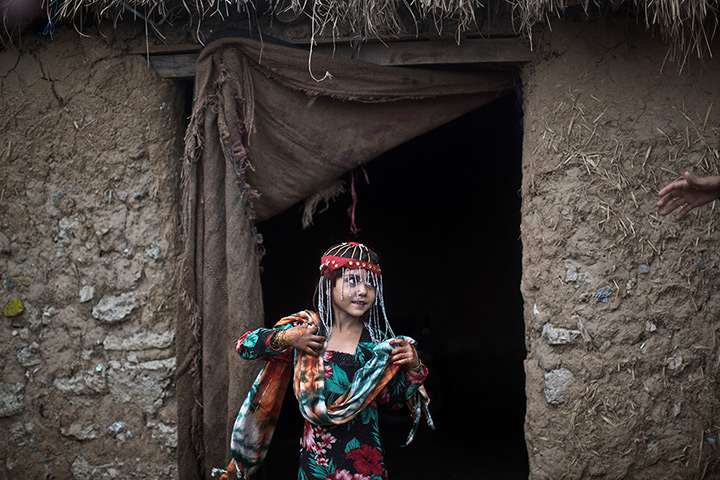 Muhammed Muheisen's Eid: Sameena Hazrat, 5, poses in new clothes