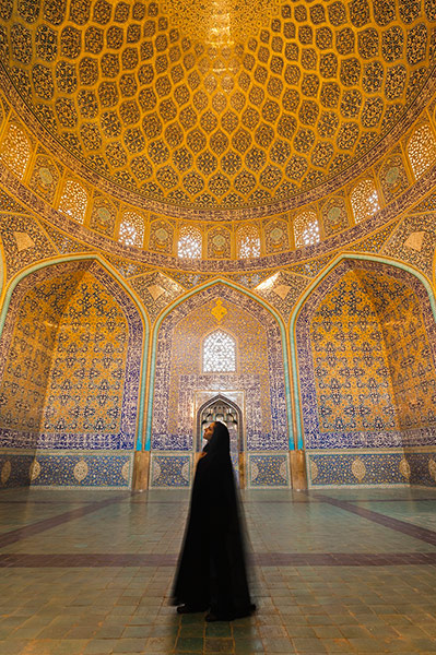 Iran Tourism Push: Iranian woman dressed in chador inside Sheikh Lotfollah Mosque