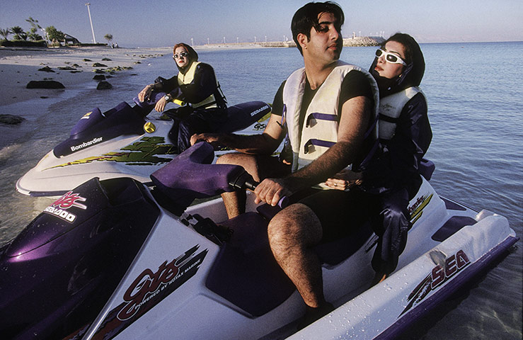 Iran Tourism Push: A man and a woman jetski together, unthinkable a few years ago