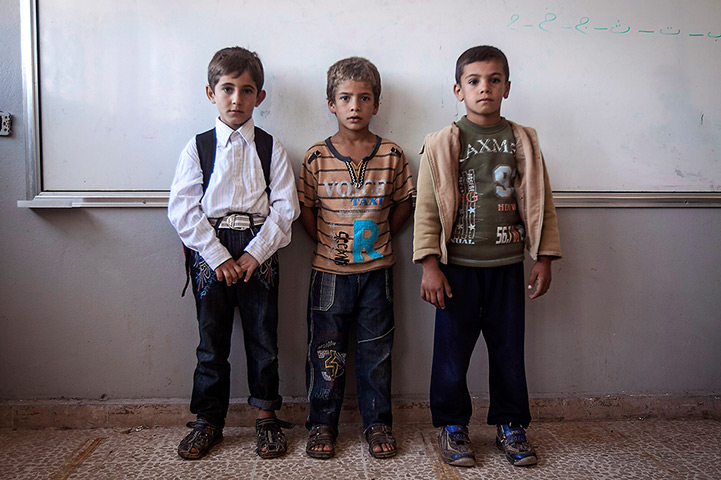 Syria schoolchildren: Syrian children pose for a portrait in the public school
