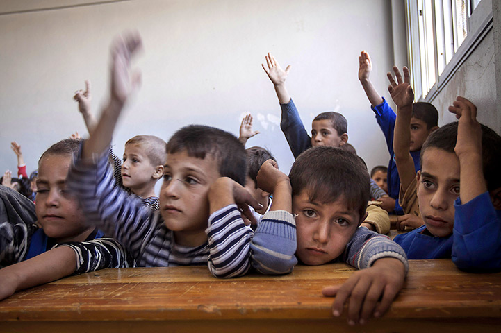Syria schoolchildren: Syrian children attend class at the public school in Madaya village
