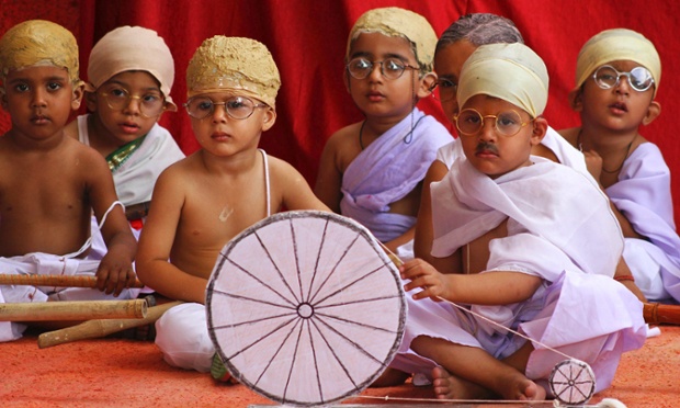 Indian children dressed like Mahatma Gandhi assemble at an event during Gandhi Jayanti in Ajmer, India, to celebrate the birth anniversary of Gandhi.