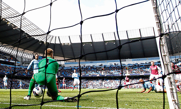 howlers: Manchester City's goalkeeper Hart drops the ball