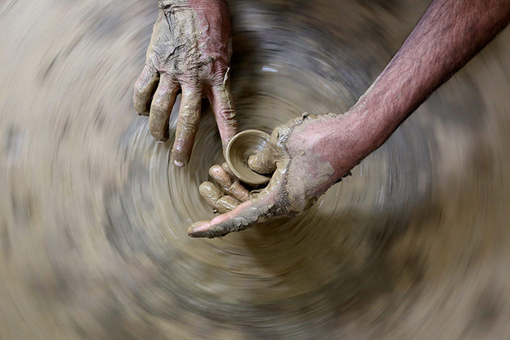 Weekend in pictures: Bhopal, India: A potter prepares clay lamps