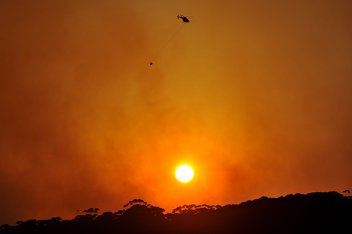 Bushfires monday: A water bombing helicopter