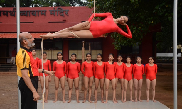 Defying gravity, a student performs the ancient sport of Mallakhamb during a practice session at Samarth Gymnasium in Mumbai, India.