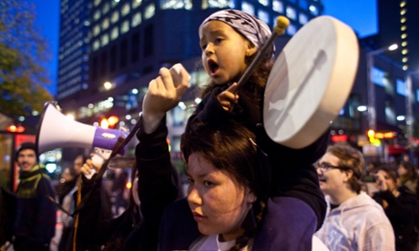 A girl plays the drums as she sings a traditional First Nations song during an anti shale gas demonstration in Montreal in support of the Mikmaq people of Elsipogtog First Nations in New Brunswick.