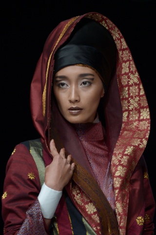 This striking portrait is of a model wearing an outfit made from one of Indonesia's traditional woven fabrics from Riau province, designed by Deden Siswanto during Jakarta fashion week.
