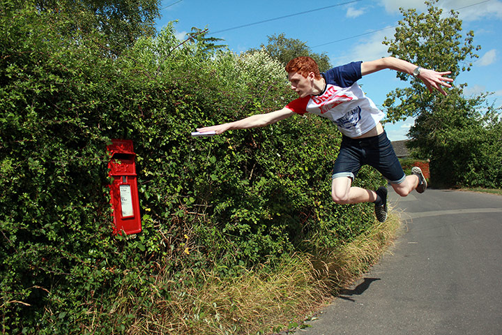 Your Pictures - Glide: boy leaping in air and pointing to red postbox
