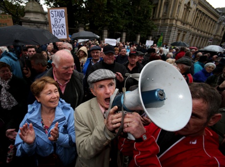 Patrick Touher from Balbriggan makes a speech during a protest by pensioners, outside Leinster House, Dublin, in reaction to Budget 2014.
