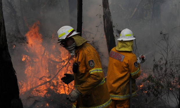 New South Wales (NSW) Rural Fire Service crews protect a property on Bulgamatta Road in the township of Berambing in the Blue Mountains, west of Sydney, Australia, 22 October 2013