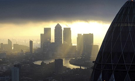 The sun streams down on Canary Wharf through the clouds