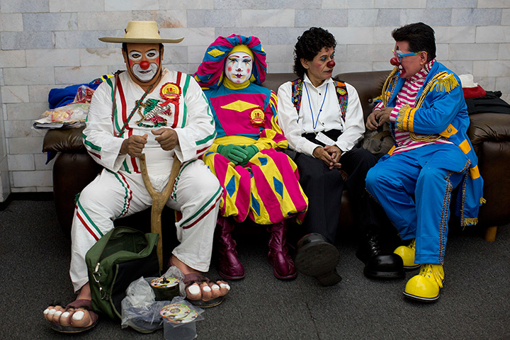 From the agencies: Clowns: Clowns sit on a bench during a break