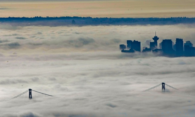A blanket of fog creates an other-worldly view over the city of Vancouver in Canada. The thick fog has covered the coast for more than a week, playing havoc with transport systems as flights and ferries have been cancelled and road travel has been treacherous.