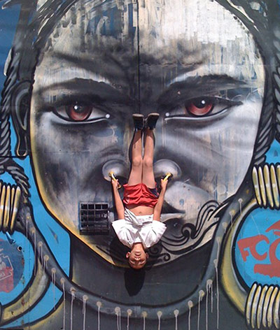 Graffiti: Kid interacting with graffiti in Bogata