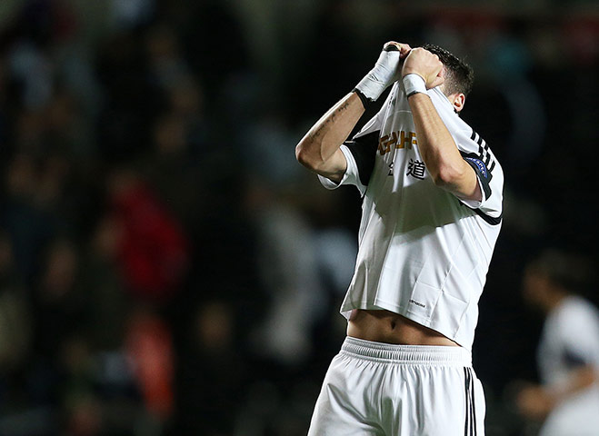 swansea: Alvaro Vazquez looks dejected 