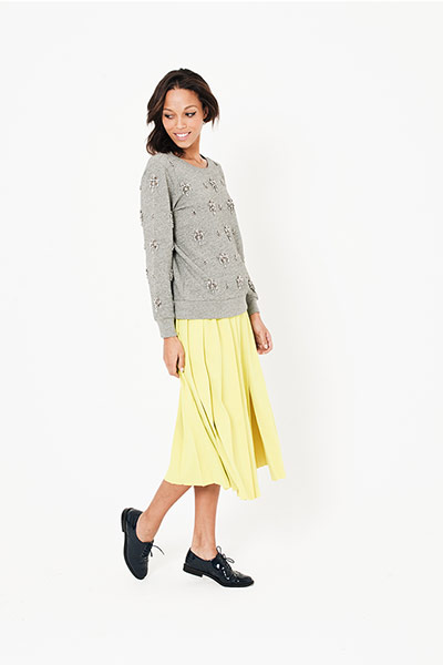 All Ages sweaters: grey sweater with jewelled embellishment yellow skirt black shiny shoes