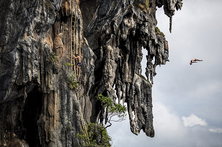 20 Photos: Blake Aldridge dives from a 25m rock at Viking Caves in the Andaman Sea