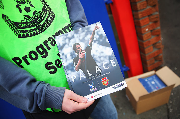 Crystal Palace v Arsenal: Match programmes sold outside the ground prior to the game at Selhurst Park