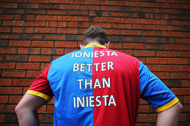 Crystal Palace v Arsenal: A Crystal Palace fan displays a message for Andres Iniesta of Barcelona