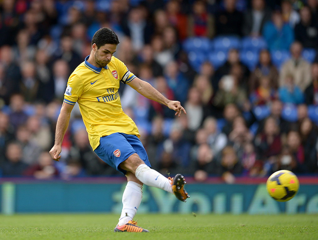 Arsenal's Mikel Arteta scores his team's opening goal from the penalty spot